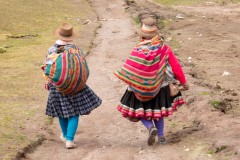 Photo of Inca Women walking down the trail from Rainbow Mountain