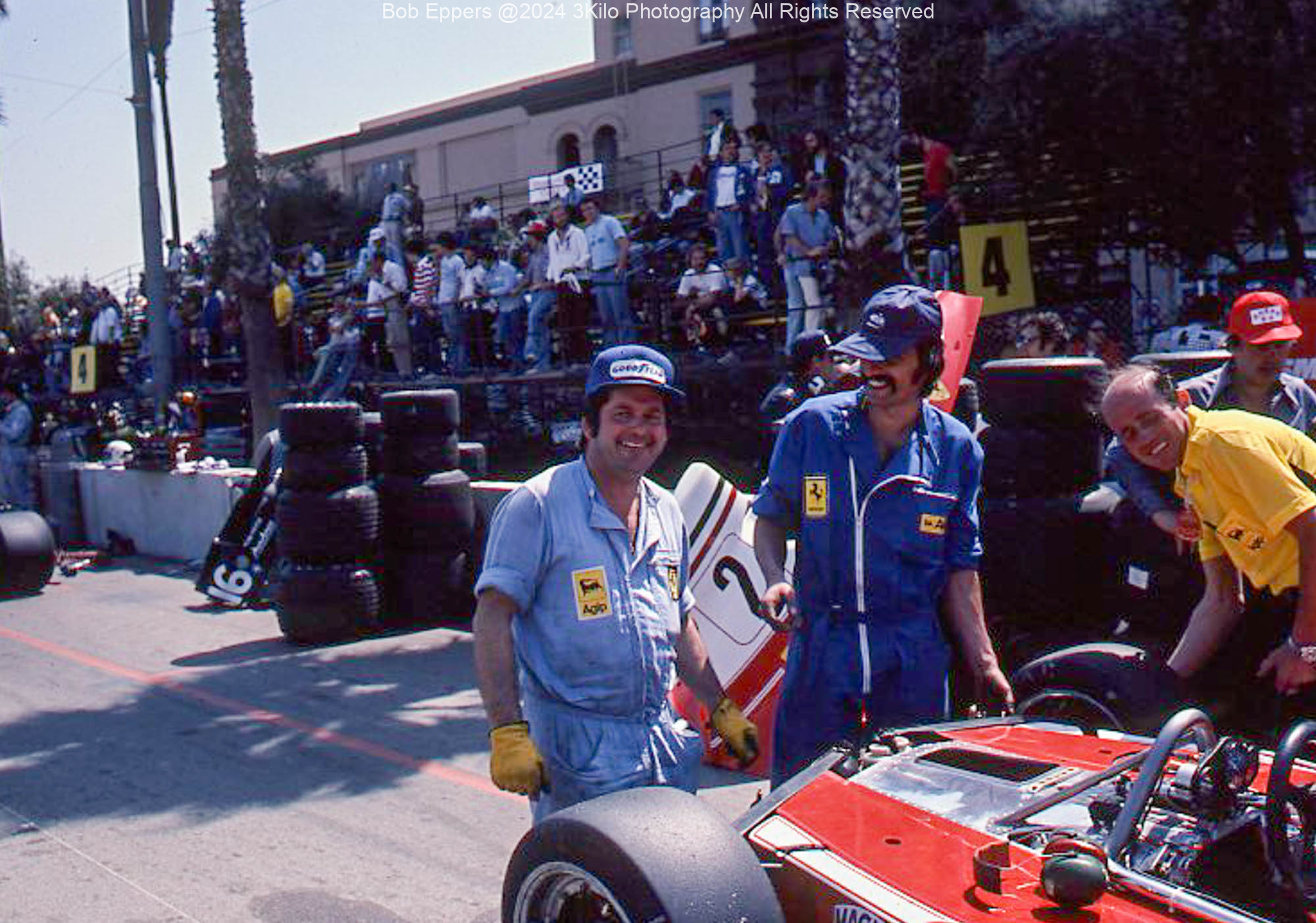 Photo of  Ferrari racing mechanics in pit lane.  1976 F1 LBGP
