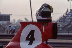 Photo of F5000 car and drivers helmet at Riverside.  1975