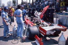 Photo of F1 Ferrari and mechanics in the pit lane.  1976