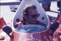 Photo of Niki Lauda in his F1 Ferrari in pit lane.  1976 F1 LBGP