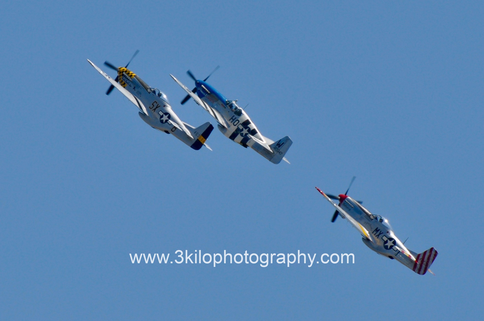 Photo of Mustang Magic at the Chino Air Show.  The unbelievable sight and sounds of 3 P-51 Mustangs doing aerobatics.